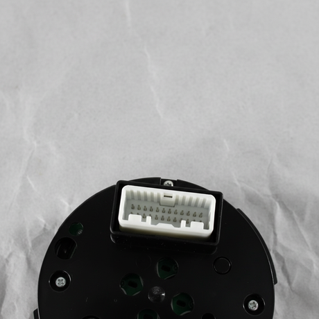 Bottom macro crop of center control switch AWD angle 2 on light grey wrinkled kraft paper