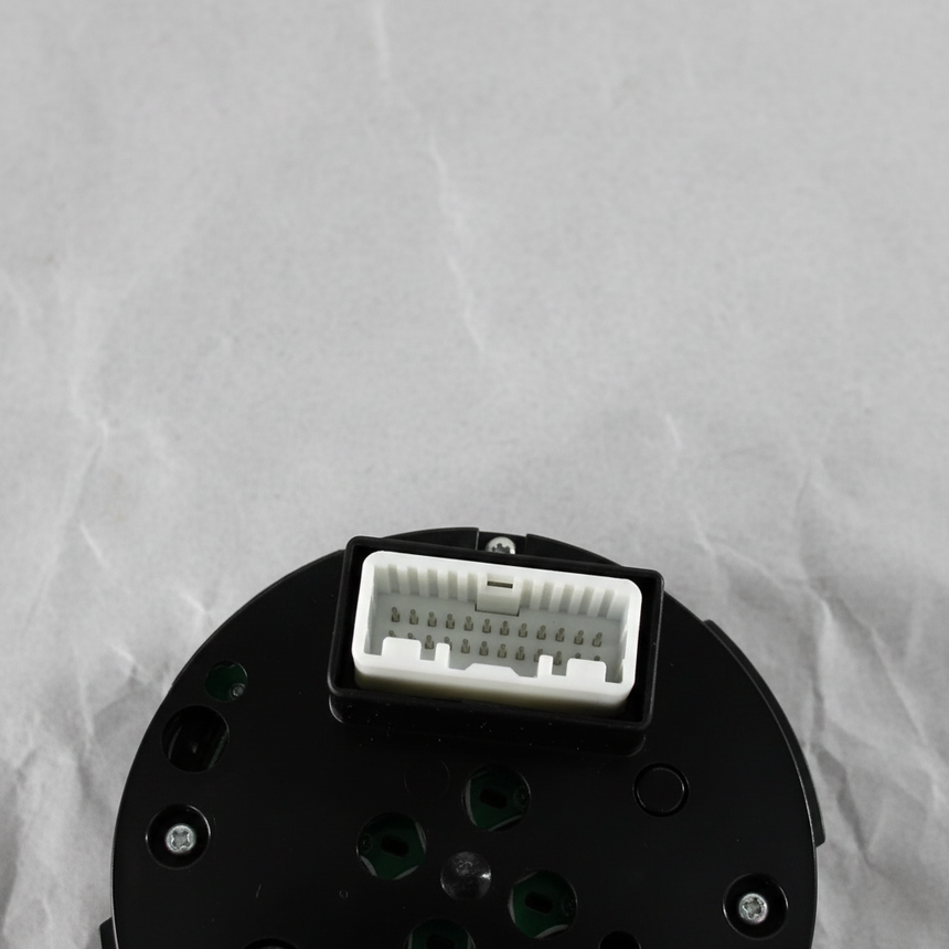 Bottom macro crop of center control switch AWD angle 2 on light grey wrinkled kraft paper