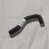 Full view of heater hose on light grey wrinkled kraft paper