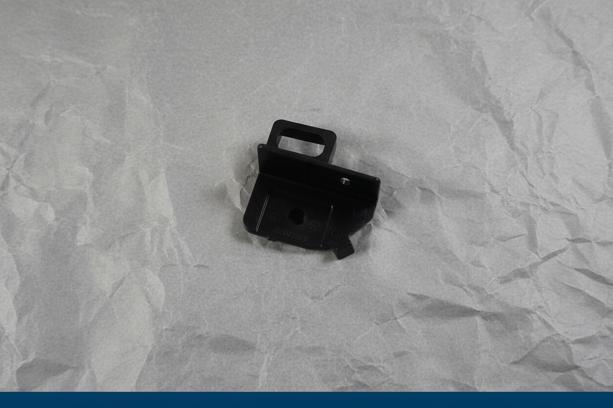 2018-2021 Buick Enclave Chevrolet Traverse Grille Support - 27 degree rotation with gray kraft paper background