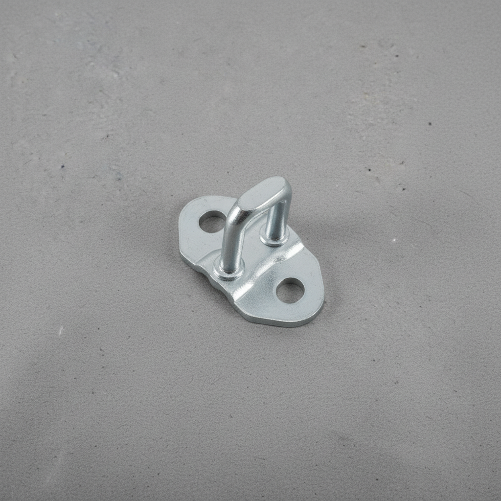 2005-2023 Tacoma 5 Ft Bed Tailgate Striker Plate OEM - rotated 30 degrees on kraft paper background