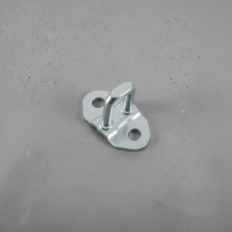 2005-2023 Tacoma 5 Ft Bed Tailgate Striker Plate OEM - rotated 30 degrees on kraft paper background