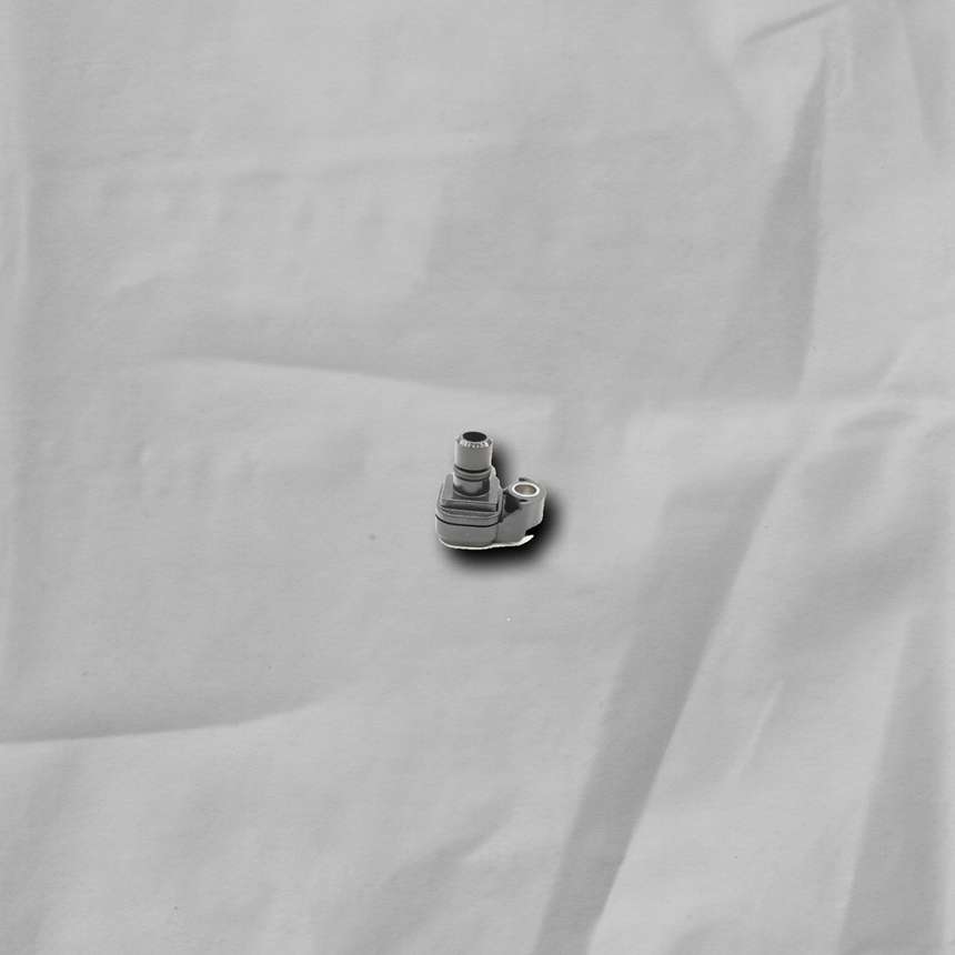 GM Duramax MAP Sensor on gray wrinkle kraft paper background