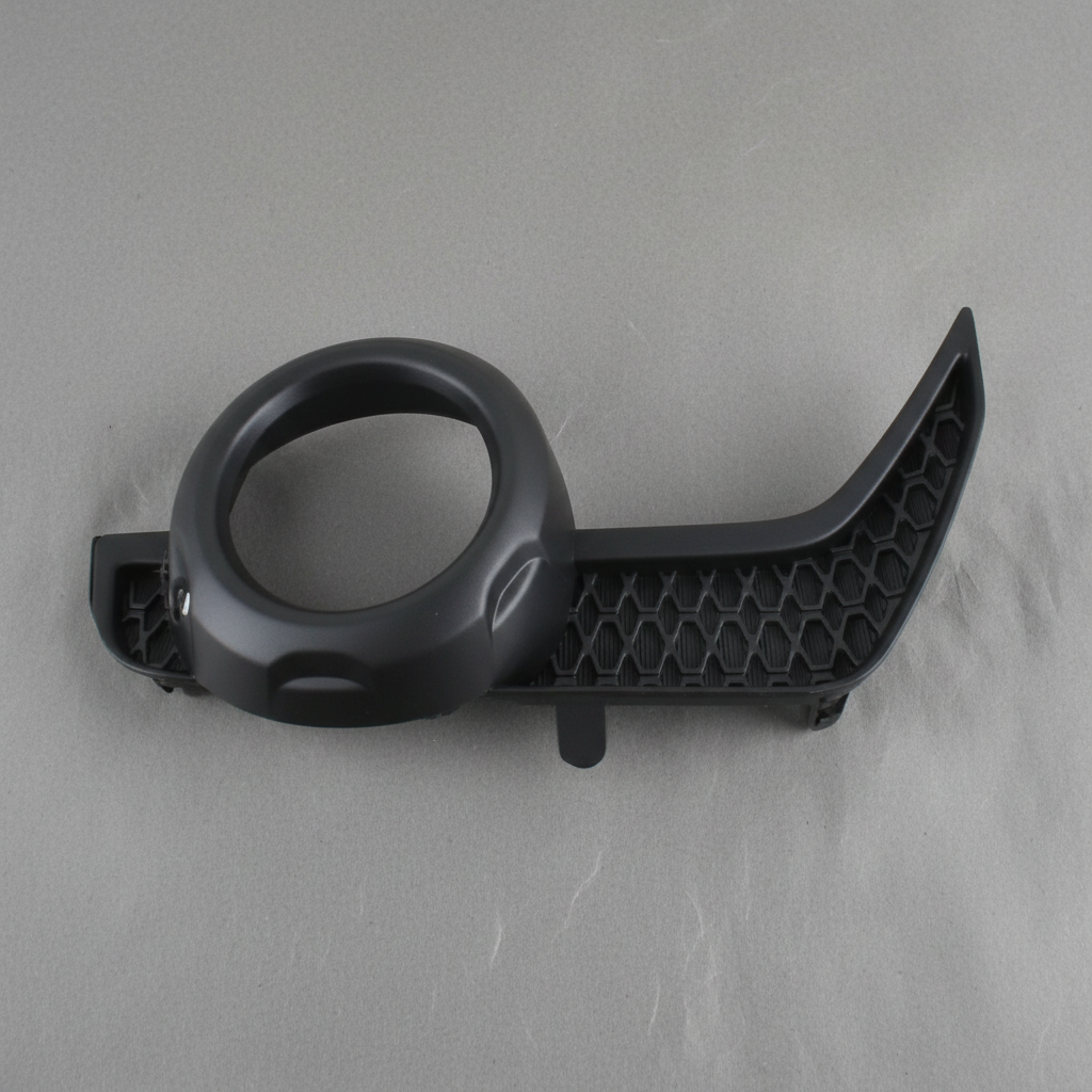 2014-2021 Toyota 4Runner Driver Side Front Fog Light Trim Genuine OEM - rotated 30 degrees on kraft paper background