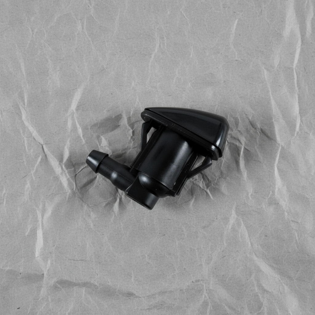 2005-2015 Toyota Tacoma Windshield Washer Nozzle OEM - rotated 30 degrees on kraft paper background