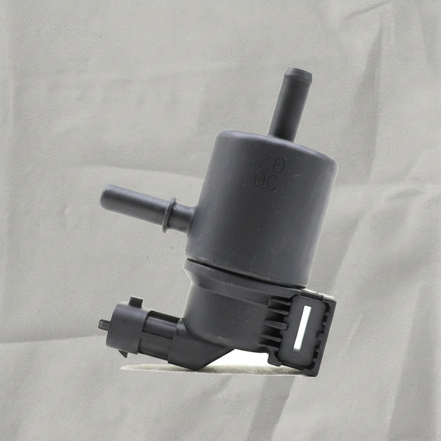 Hyundai Kia 1.6L Vapor Canister Purge Solenoid on gray wrinkle kraft paper background