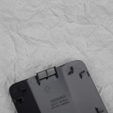 2024-2025 Nissan Rogue Rear Bumper Towing Eye Cover Cap Unpainted OEM - Top Detail Angle 2