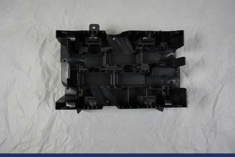 2013-2014 GM Fuse Relay Mount Bracket - 27 degree rotation with gray kraft paper background