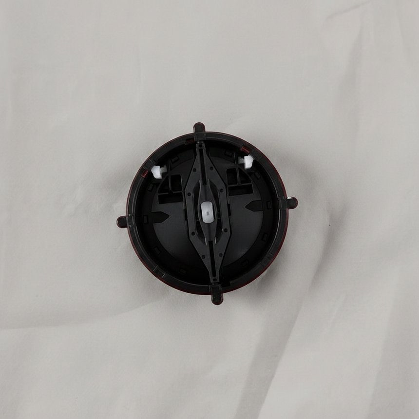 Door mirror drive motor actuator on grey wrinkled kraft paper background