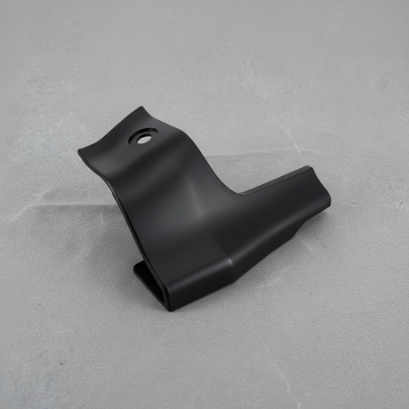 2005-2015 Toyota Tacoma Passenger Side Rear Corner Garnish OEM - rotated 30 degrees on kraft paper background