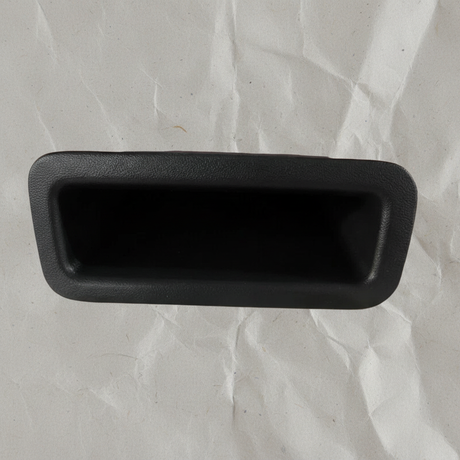 Top macro crop of pull handle on light grey wrinkled kraft paper