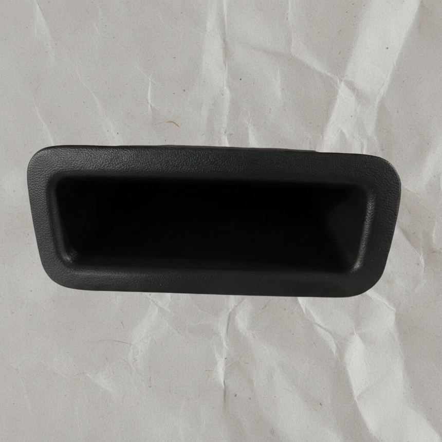 Top macro crop of pull handle on light grey wrinkled kraft paper