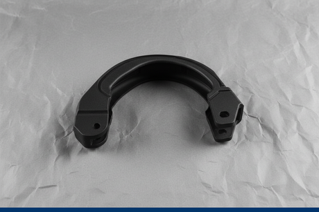 2020-2024 Ford Explorer Lincoln Aviator 3rd Row Seat Hinge Cover OEM - Rotated 27 degrees on gray kraft paper background