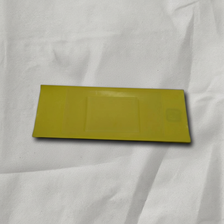 Acura MDX RDX RLX TLX rain sensor adhesive kit on light grey wrinkled kraft paper background, packaging removed