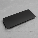 Close-up of GM OEM Black Unpainted Front Bumper Tow Eye Access Hole Cover