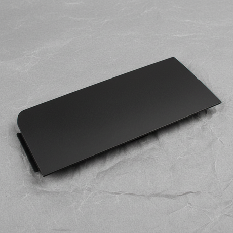 Close-up of GM OEM Black Unpainted Front Bumper Tow Eye Access Hole Cover