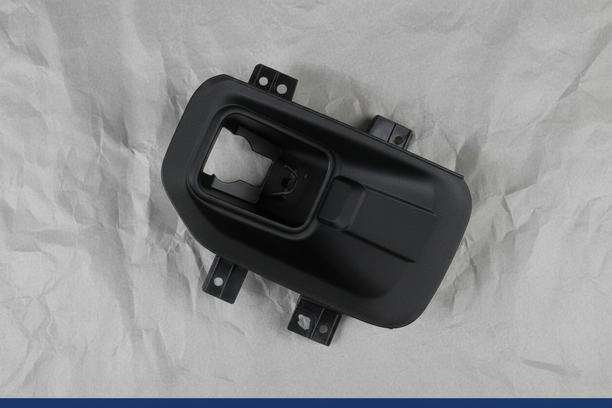 2015-2017 Ford F-150 Front Passenger Side Fog Light Lamp Bracket OEM - Rotated 27 degrees on gray kraft paper background