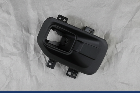 2015-2017 Ford F-150 Front Passenger Side Fog Light Lamp Bracket OEM - Rotated 27 degrees on gray kraft paper background